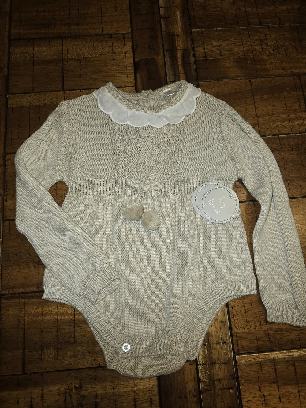 Tiny Threads Cream Knit Baby One-Piece with Pom Ties